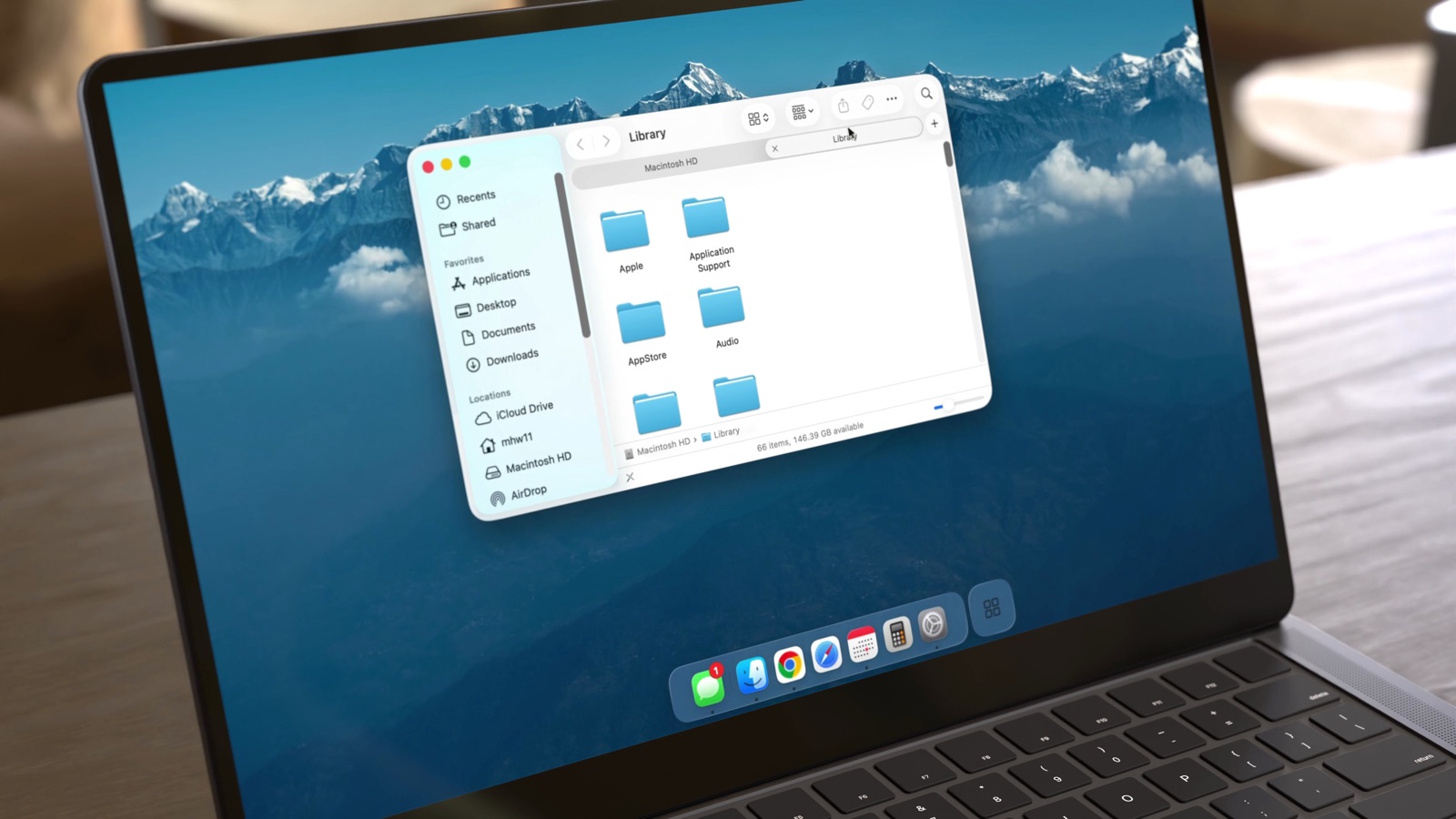 The taskbar along the bottom of a MacBook screen, with a Finder window open