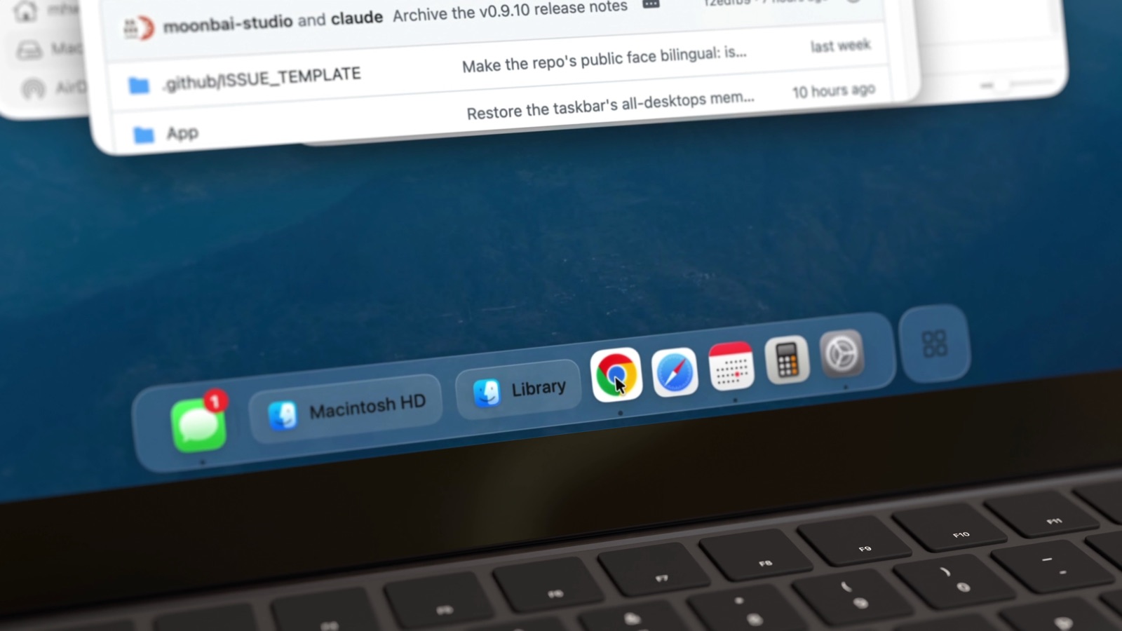 Close-up of the taskbar: Messages, two Finder windows titled Macintosh HD and Library, then app icons