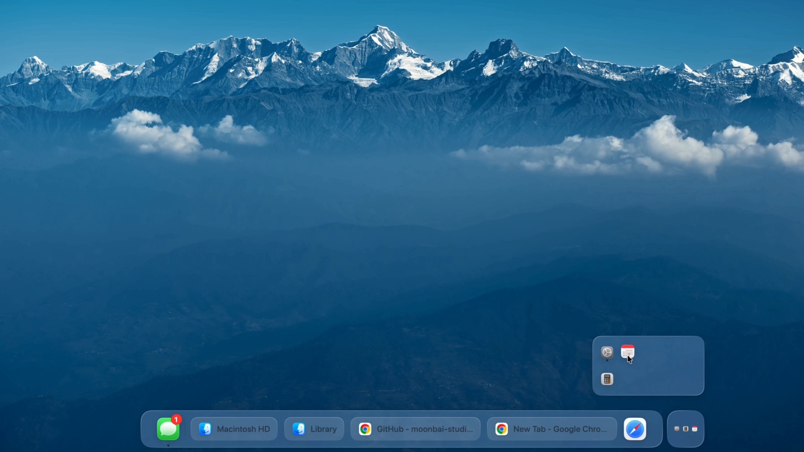 The drawer open above the right end of the taskbar, holding three app icons